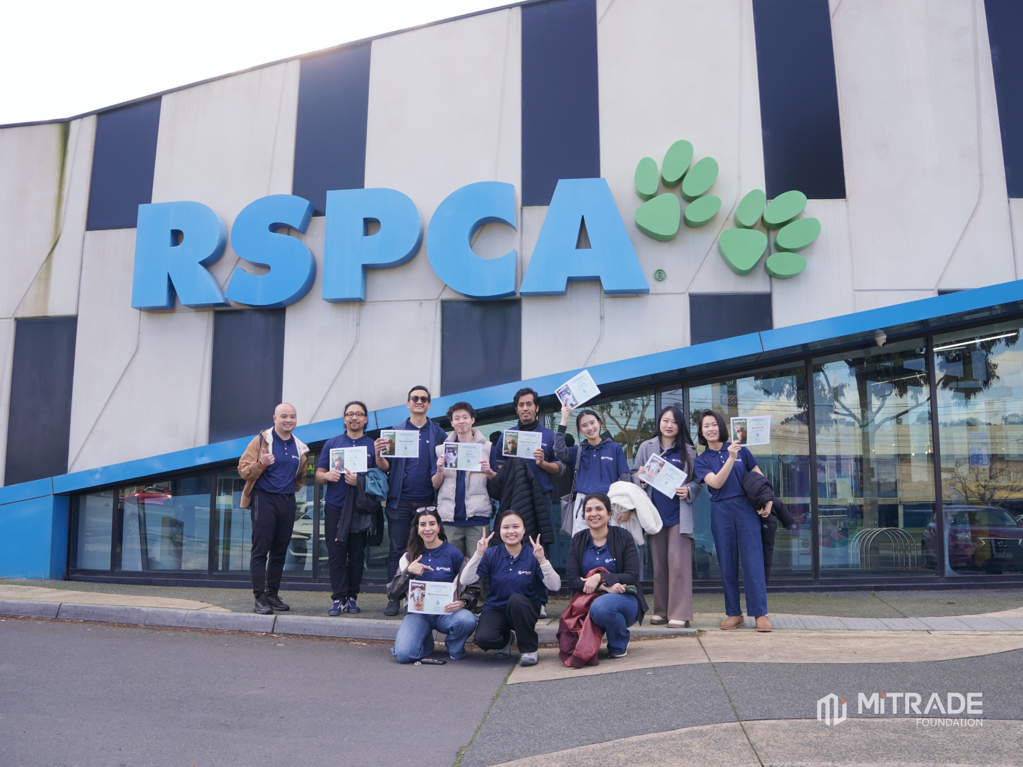 Mitrade volunteers standing outside the RSPCA Victoria building